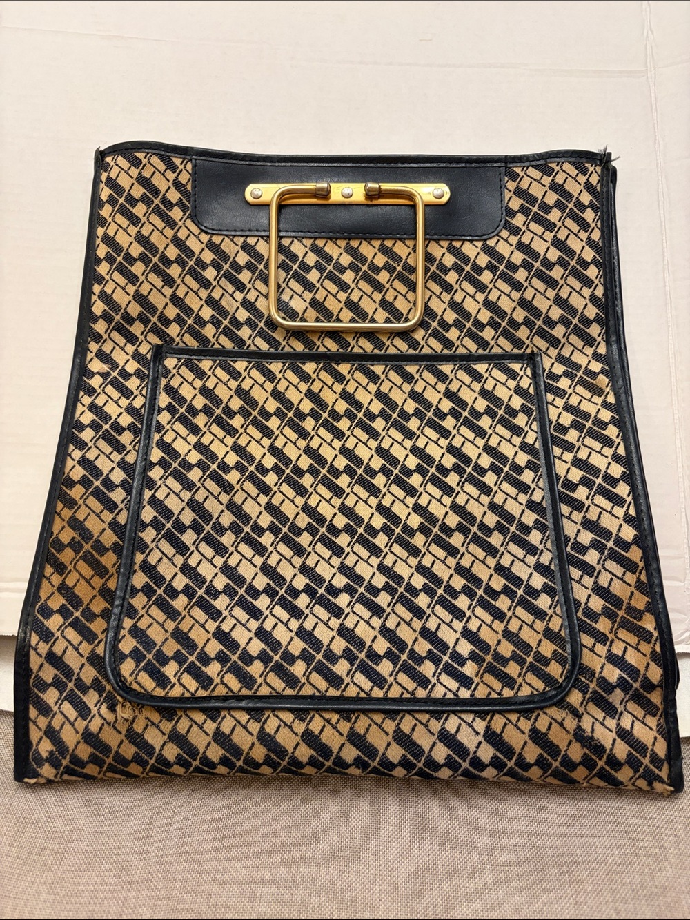 authentic vintage 1970s Saks Fifth Avenue Monogram Sac Plat handbag.